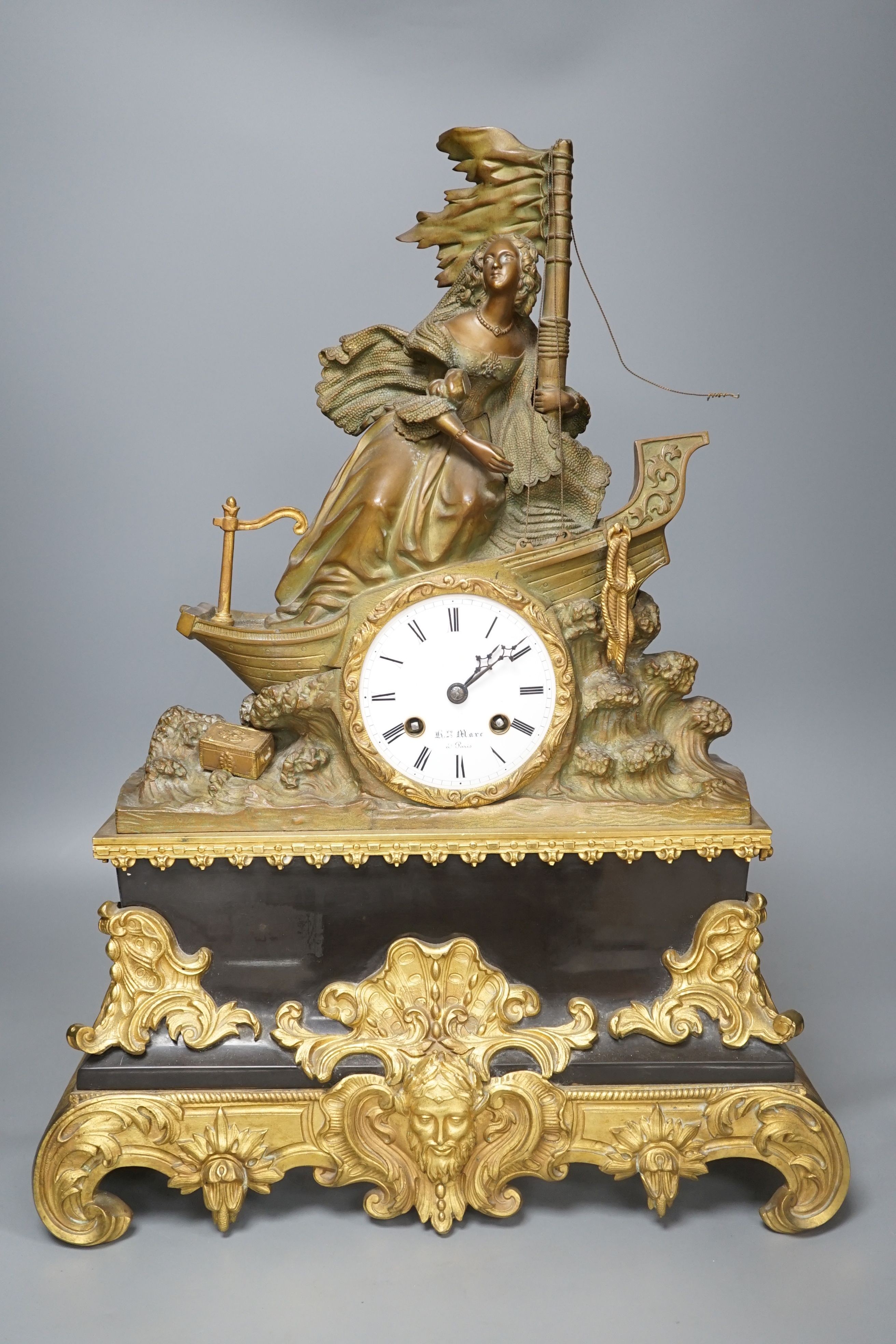 A 19th century French bronze and ormolu mounted black marble mantel clock, 48cms high.